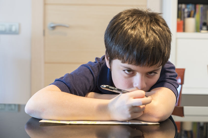 36712705 - child doing school homework at home